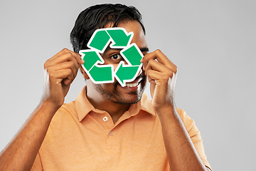 Image showing smiling indian man holding green recycling sign