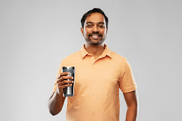 Image showing indian man with thermo cup or tumbler for drink