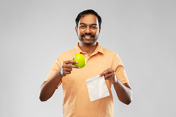 Image showing indian man with apple and reusable canvas bag