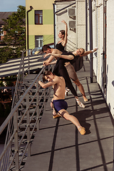 Image showing The group of modern ballet dancers performing on the stairs at the city