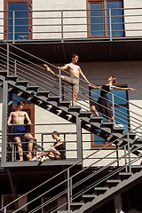 Image showing The group of modern ballet dancers performing on the stairs at the city