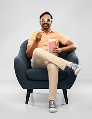 Image showing happy man in 3d movie glasses eating popcorn