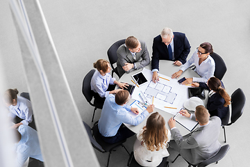 Image showing architects with laptop and blueprint at office