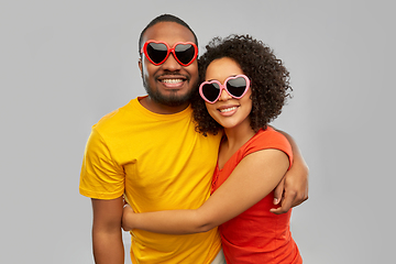 Image showing happy african couple in heart shaped suglasses