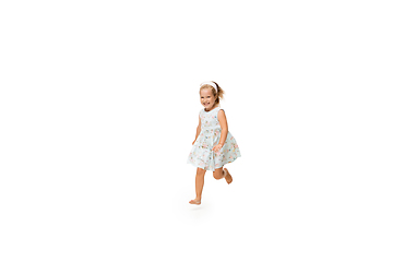 Image showing Happy little caucasian girl jumping and running isolated on white background