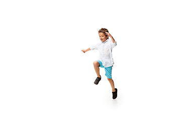 Image showing Happy little caucasian boy jumping and running isolated on white background