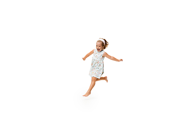 Image showing Happy little caucasian girl jumping and running isolated on white background