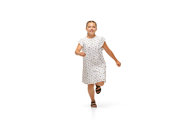 Image showing Happy little caucasian girl jumping and running isolated on white background