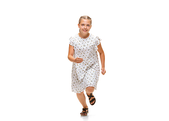 Image showing Happy little caucasian girl jumping and running isolated on white background