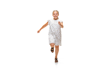 Image showing Happy little caucasian girl jumping and running isolated on white background