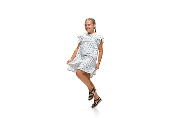 Image showing Happy little caucasian girl jumping and running isolated on white background