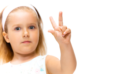 Image showing Little girl gesturing isolated on white studio background with copyspace