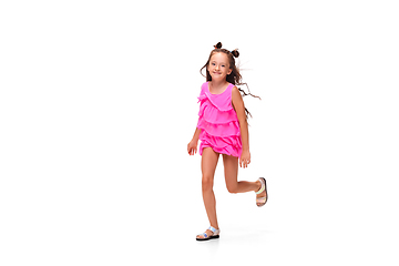 Image showing Happy little caucasian girl jumping and running isolated on white background