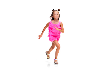 Image showing Happy little caucasian girl jumping and running isolated on white background