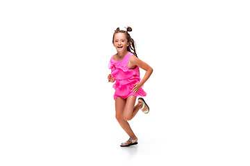 Image showing Happy little caucasian girl jumping and running isolated on white background