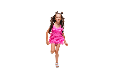 Image showing Happy little caucasian girl jumping and running isolated on white background