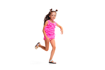 Image showing Happy little caucasian girl jumping and running isolated on white background