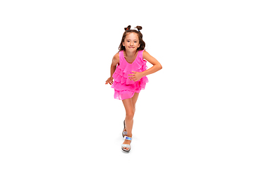 Image showing Happy little caucasian girl jumping and running isolated on white background