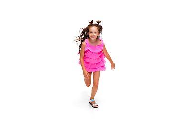 Image showing Happy little caucasian girl jumping and running isolated on white background