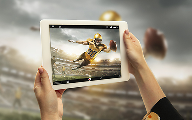 Image showing Close up hands holding tablet viewing sport, online translation, streaming of championship