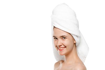 Image showing Beauty Day. Woman wearing towel doing her daily skincare routine isolated on white studio background