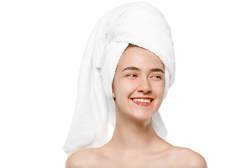 Image showing Beauty Day. Woman wearing towel doing her daily skincare routine isolated on white studio background