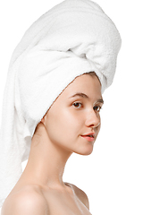 Image showing Beauty Day. Woman wearing towel doing her daily skincare routine isolated on white studio background