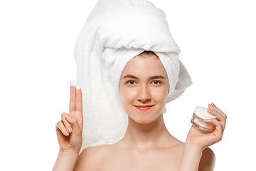 Image showing Beauty Day. Woman wearing towel doing her daily skincare routine isolated on white studio background