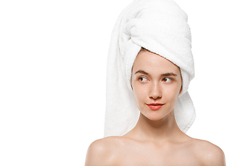 Image showing Beauty Day. Woman wearing towel doing her daily skincare routine isolated on white studio background