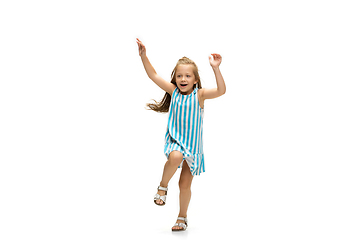 Image showing Happy little caucasian girl jumping and running isolated on white background