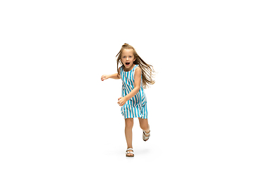 Image showing Happy little caucasian girl jumping and running isolated on white background