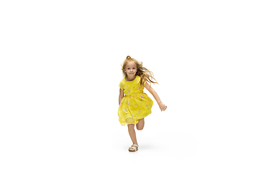 Image showing Happy little caucasian girl jumping and running isolated on white background