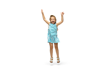 Image showing Happy little caucasian girl jumping and running isolated on white background