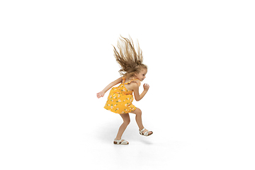 Image showing Happy little caucasian girl jumping and running isolated on white background