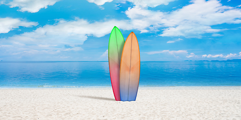 Image showing Summer concept flyer. Surfing boards with beach, sand and ocean or sea on background