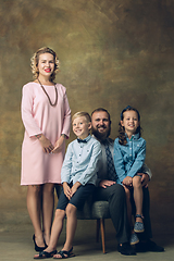 Image showing Happy family traditional portrait, old-fashioned. Cheerful parents and kids