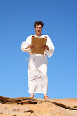 Image showing Man in robe reading 