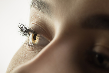 Image showing Close up of face of beautiful caucasian young woman, focus on eyes. Human emotions, facial expression, cosmetology, body and skin care concept.