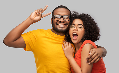 Image showing happy african american couple in glasses hugging