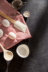 Image showing eggs, flour, spoon, spatula, strainer and towel