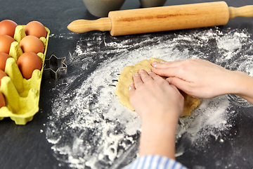 Image showing hands making shortcrust pastry dough on table