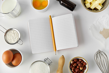 Image showing recipe book and cooking ingredients on table