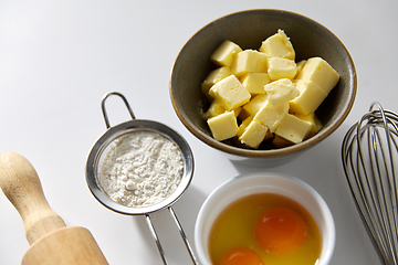 Image showing rolling pin, butter, eggs, flour and whisk