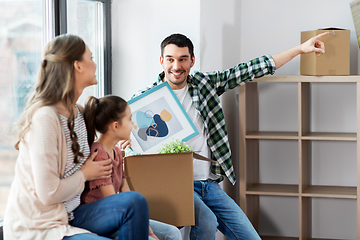 Image showing happy family with child moving to new home