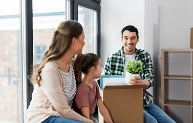 Image showing happy family with child moving to new home