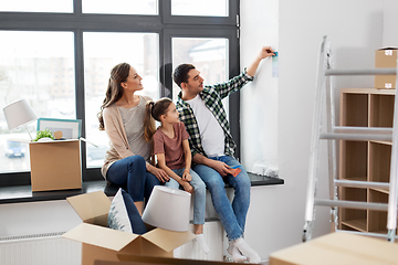 Image showing happy family with color palette moving to new home