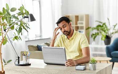 Image showing indian man with laptop working at home office