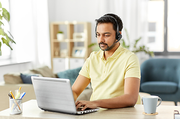 Image showing indian man with headset and laptop working at home