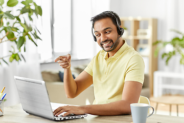 Image showing indian man with headset and laptop working at home