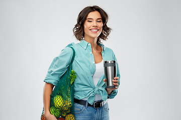 Image showing happy smiling woman with food in reusable net bag